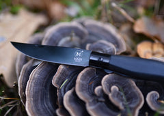 M Main Pocket knife with Black pressed wood handle and PU loop. Blade made from stainless steel 440A with Black Titanium coating.Blade length – 87 mm. SUPER BLACK.